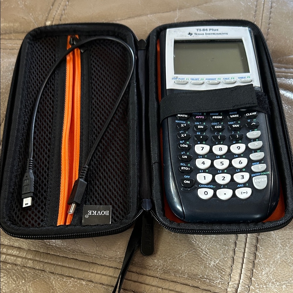 Texas Instruments Graphing Calculator 84 with Black and White Design with case.